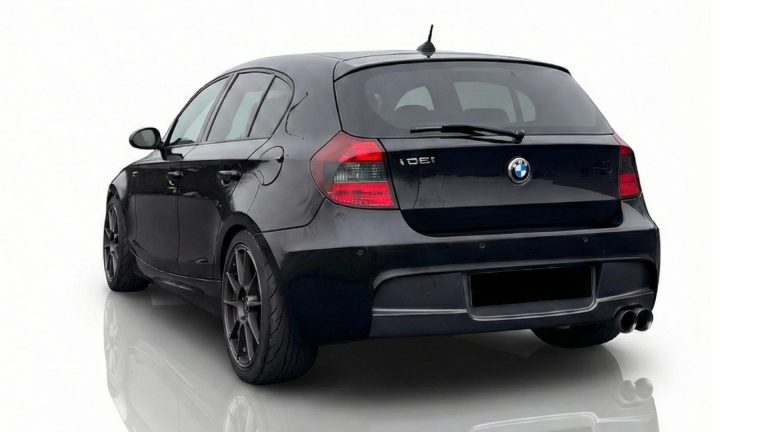 Rear view of the BMW 130i performance rental, featuring a classic naturally aspirated 3.0-liter inline-six.