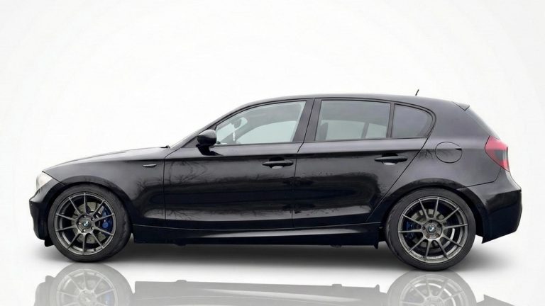 Side profile of the BMW 130i track rental showing its optimized stance and KW Clubsport suspension.