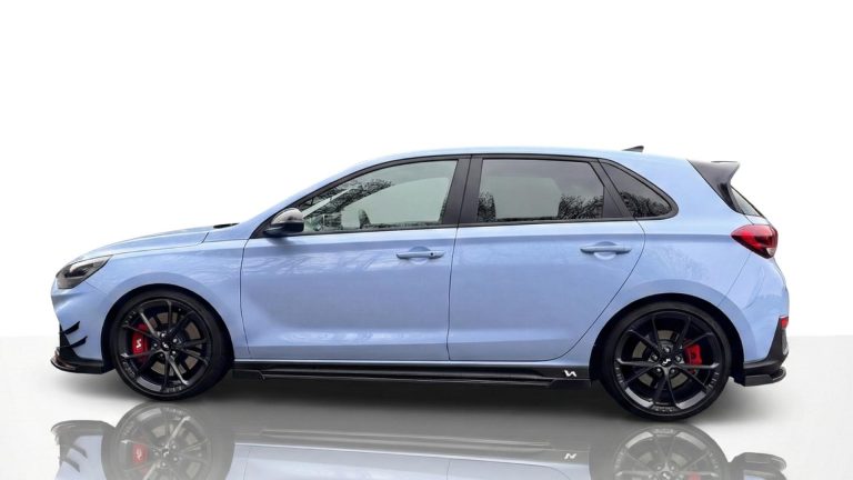 Hyundai i30N Side profile of the Hyundai i30 N showing the N performance suspension and high-grip tyres for the circuit.