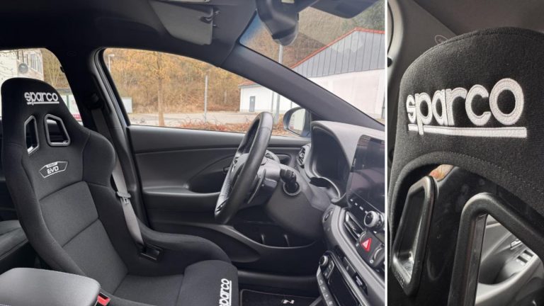 Hyundai i30N Close-up of the professional Sparco Evo bucket seats and safety harness in the Hyundai i30 N track rental.