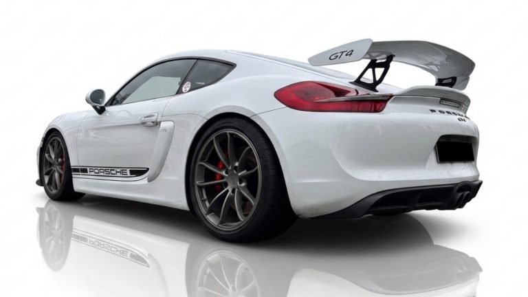 Rear view of the Porsche Cayman GT4 Clubsport for Nürburgring track days, featuring a massive aerodynamic rear wing.