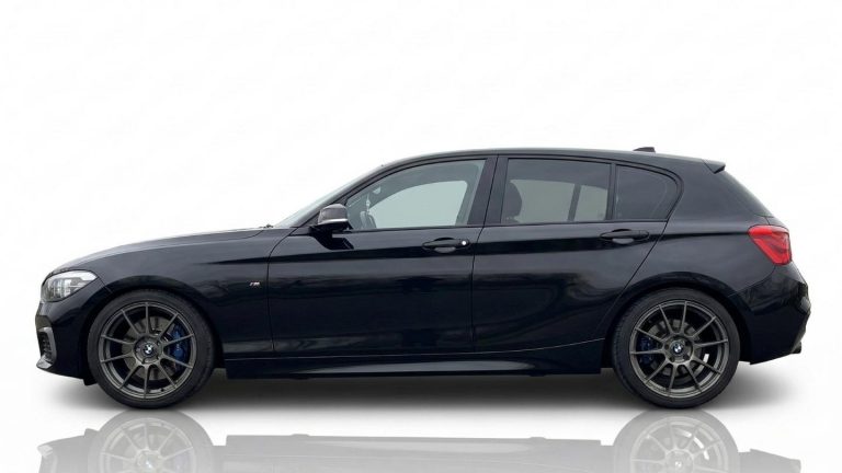 BMW F21 120i Side profile of the BMW 120i track rental showing its optimized setup for building confidence on the circuit.